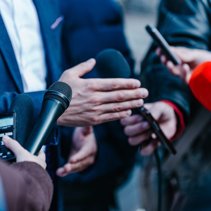 Interviewing businessman on press conference Press & communication